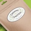 Etiqueta adesiva oval branca personalizada em saco de papel com escrita de proteína orgânica