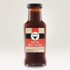 garrafa de vidro para molho barbecue com etiqueta adesiva personalizada indicando o produto.
